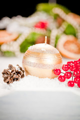 Christmas background with red bauble,snow and snowflakes 