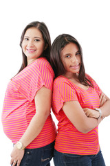 Beautiful hispanic pregnant woman with her daughter