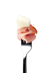 Prosciutto on fork