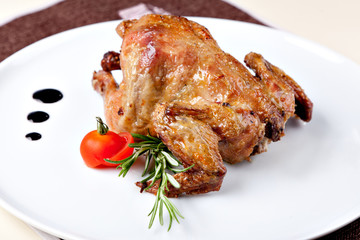 Grilled chicken on a white plate