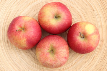 Naklejka na ściany i meble Fresh red apples on wooden background