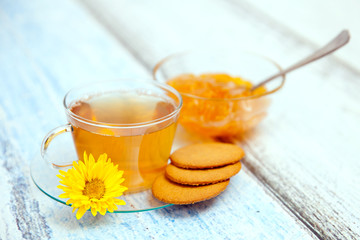 The cup of green tea on table
