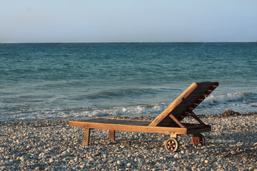 Wooden chair on the beach
