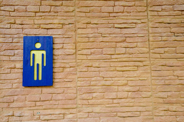 Fototapeta na wymiar Toilet sign on wall