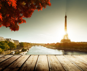 wooden deck table and  Eiffel tower in autumn