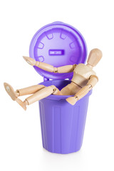 Wooden mannequin doll sitting in purple dustbin can, isolated