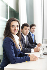 Business team smiling at the office, lined up