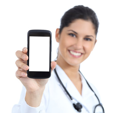 Female Doctor Smiling And Showing A Blank Smart Phone Screen