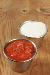Tin cups of salsa and ranch dressing