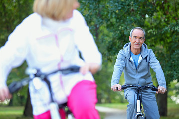 Middle-aged couple on a bike ride