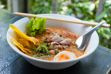 Pork noodle tom yum, condensed water egg.