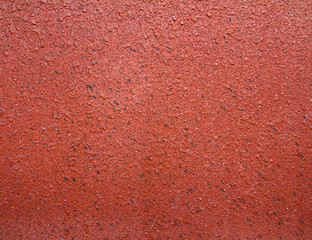 Surface of sandstone plastered concrete walls, orange and brown