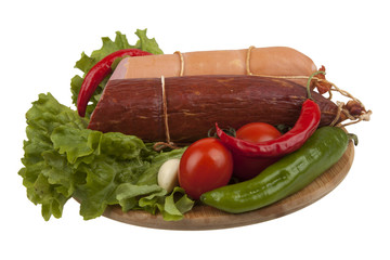 Sausage with vegetables on board