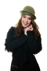 The young beautiful woman in an autumn beret on a head