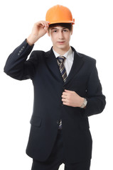 The businessman in a business suit and building helmet