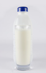 Milk bottle with glass of milk 2