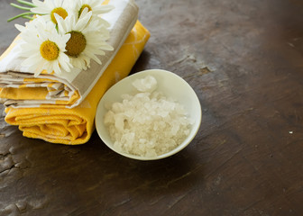Sea salt in bowl on wooden background