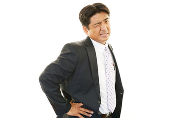 腰痛を訴えるビジネスマン