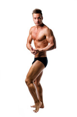 Handsome athletic young man in bodybuilder pose, isolated
