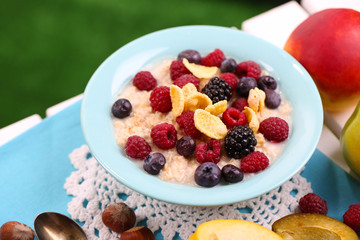 Oatmeal in plate with berries