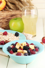 Oatmeal in plates with berries