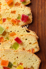 Biscotti with candied fruits, on wooden background