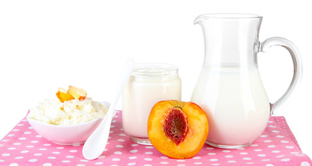 Fresh dairy products with peaches isolated on white