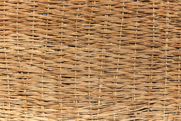 Obraz premium a woven willow wicker fence panel suitable for crafts, picnic or