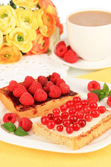 Delicious toast with berries on table close-up