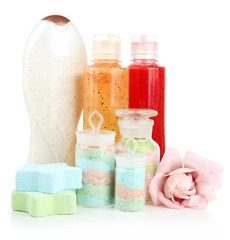 Obraz na płótnie Canvas Aromatic salts in glass bottles and body scrubs, isolated