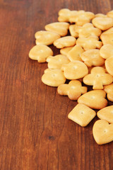 Delicious crackers on wooden background