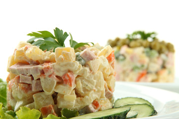 Russian traditional salad Olivier, isolated on white