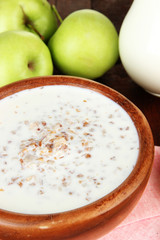 Buckwheat porridge with milk on table close-up