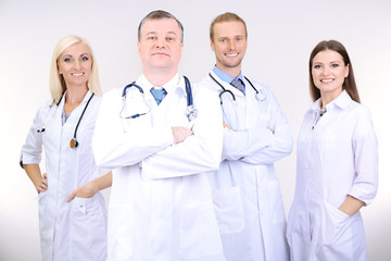 Fototapeta premium Medical workers on grey background