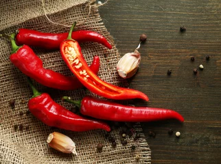 Gardinen Chilischoten Red hot chili peppers  and garlic,  © Africa Studio