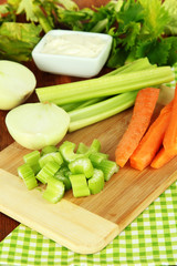 Fresh green celery with vegetables on table close-up