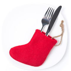 Obraz na płótnie Canvas Christmas table setting with red boots, isolated on white