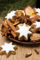 cookies in the shape of stars with icing and spices