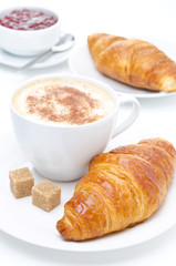 fresh croissant, coffee and jam for breakfast