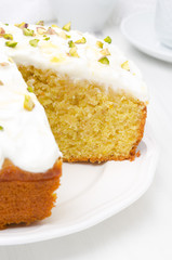 orange cake with Greek yogurt, honey and pistachios in a cut