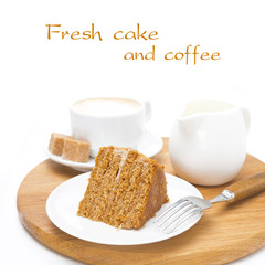 piece of honey cake, fresh cream and cappuccino on board