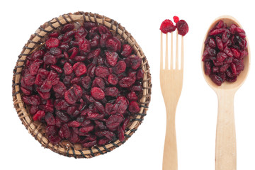 Spoon, a fork, a plate with dried cranberries