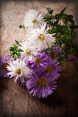 asters on a wooden table