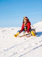 little girl sledging