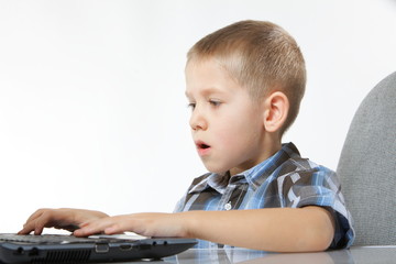 Fototapeta na wymiar Computer addiction child with laptop notebook