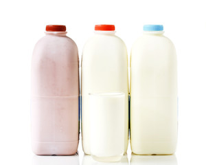 Bottles of Milk on Isolated White Background