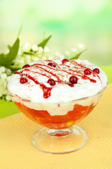 Tasty jelly in bowl on table on light background