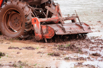 Tractor plowing the fields