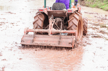 Obraz premium Tractor plowing the fields