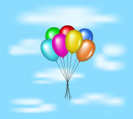 Multicolored balloons flying on blue sky